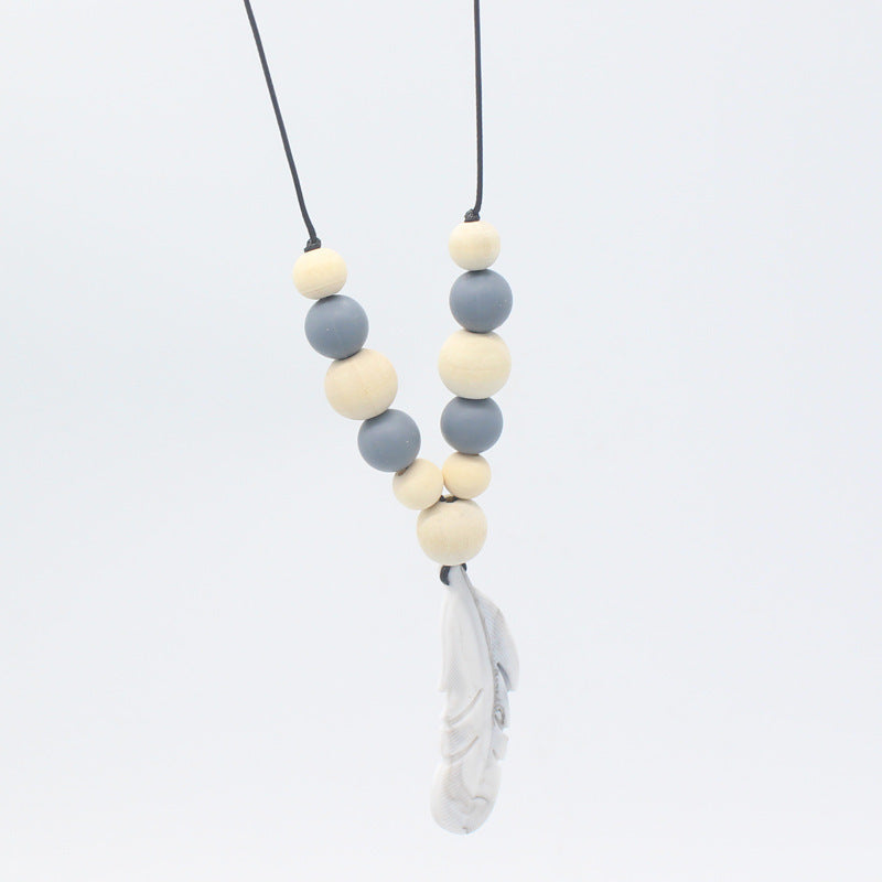 FeatherBite™ Baby Silicone Necklace – Soothing Teething Relief