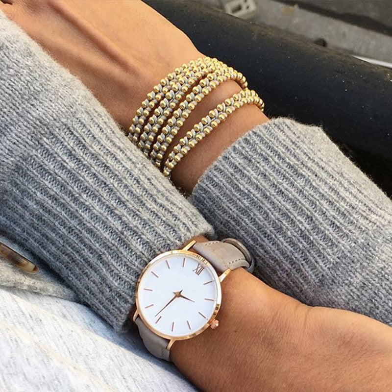 Elegant Frosty Round Dial Women's Quartz Watch with Textile Strap