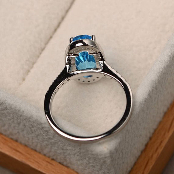 Elegant Oval Geometric Brass and White Steel Topaz Engagement Ring