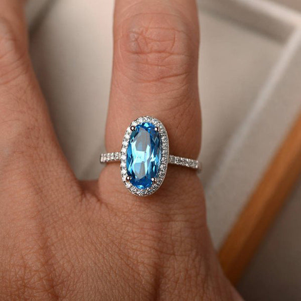 Elegant Oval Geometric Brass and White Steel Topaz Engagement Ring