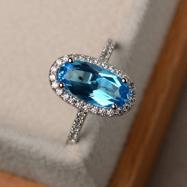 Elegant Oval Geometric Brass and White Steel Topaz Engagement Ring