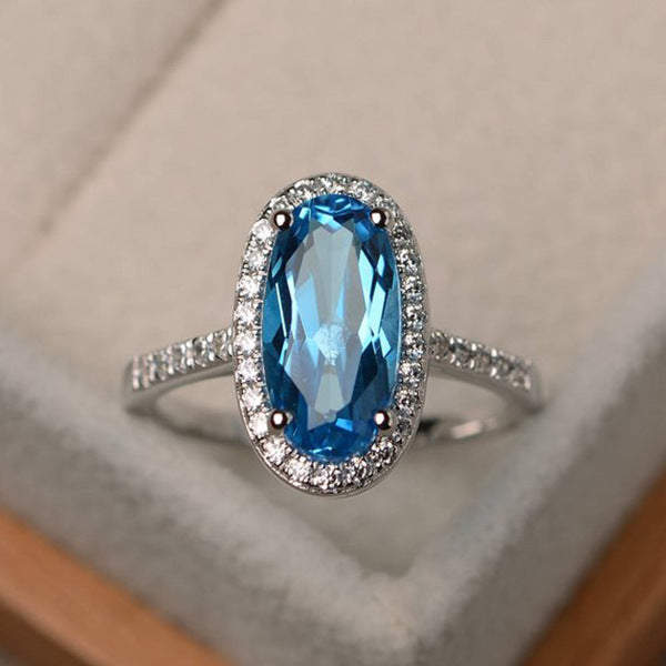 Elegant Oval Geometric Brass and White Steel Topaz Engagement Ring